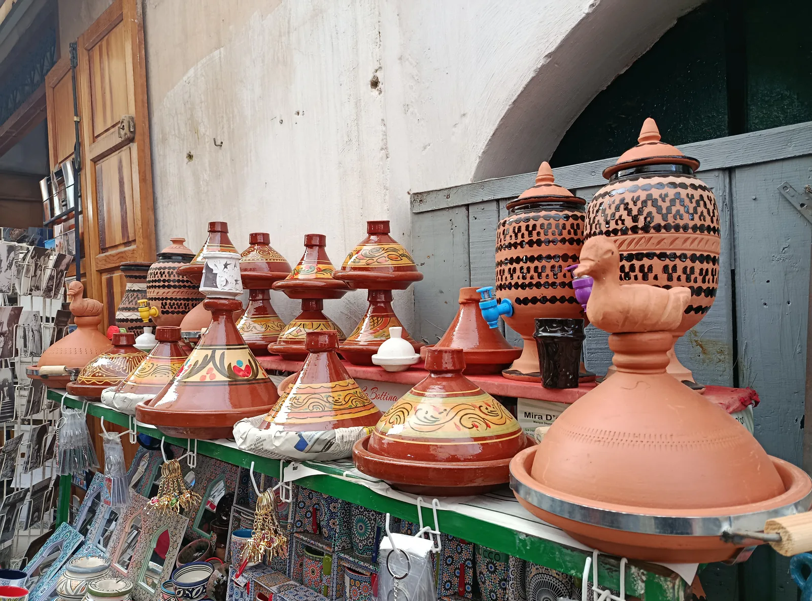 Decorated clay tagine pots displayed for sale